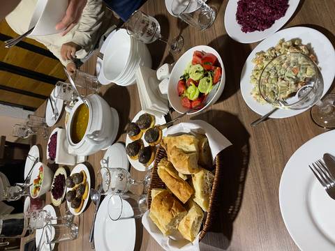       Table setting with various traditional foods and dishes.
  