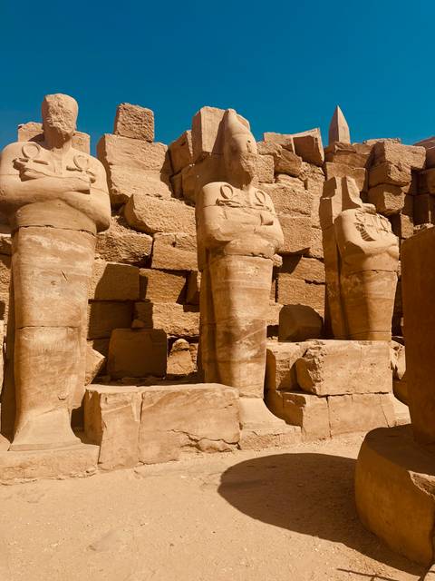       Close-up of ancient Egyptian statues.
  