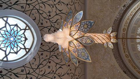 Ornate chandelier in a mosque with detailed ceiling.