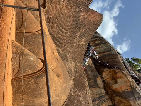       Visitors ascending the rock fortress of Sigiriya.
  