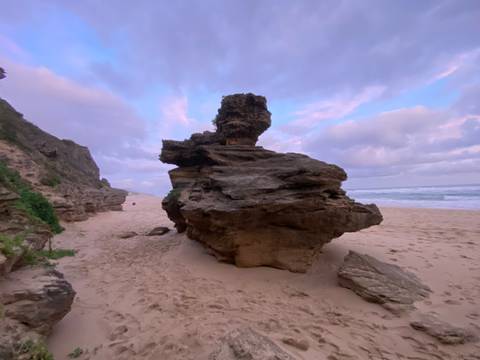       Rock formations on a beach.
  