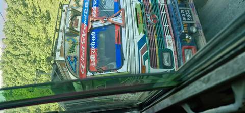Decorated colorful bus on the road.