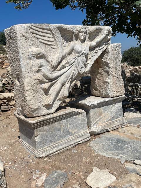 Close-up of ancient stone ruins with intricate carvings.