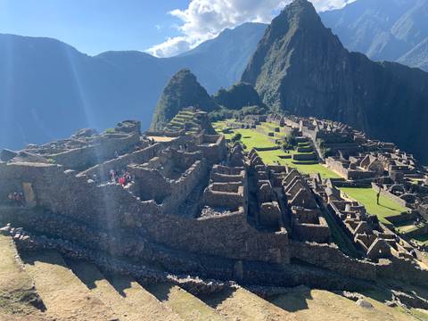      Iconic view of Machu Picchu under a clear blue sky.
  