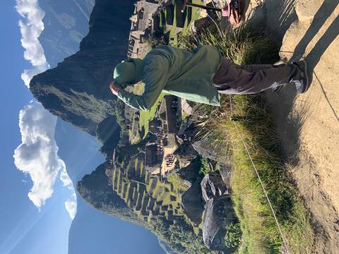       Person overlooking Machu Picchu from a vantage point.
  