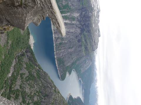       Stunning cliff landscape with a blue fjord.
  