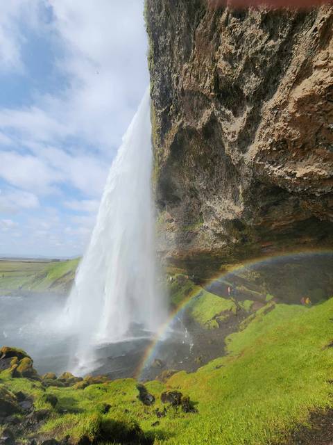 Waterfall with a rainbow in the foreground