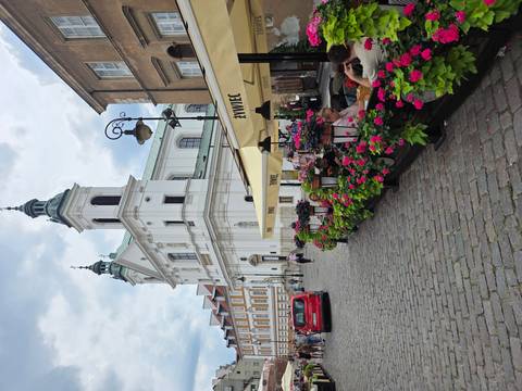 Street view with outdoor cafes and people sitting