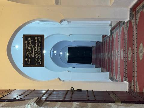       Interior of a mosque with arched hallways
  
