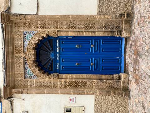       Blue ornate door with intricate design
  