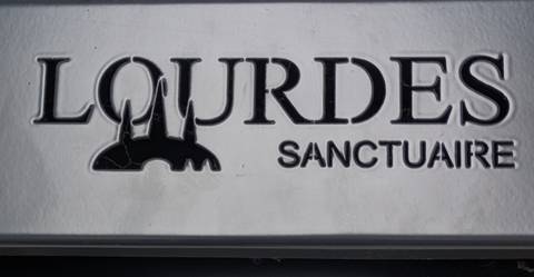       Lourdes Sanctuaire sign
  