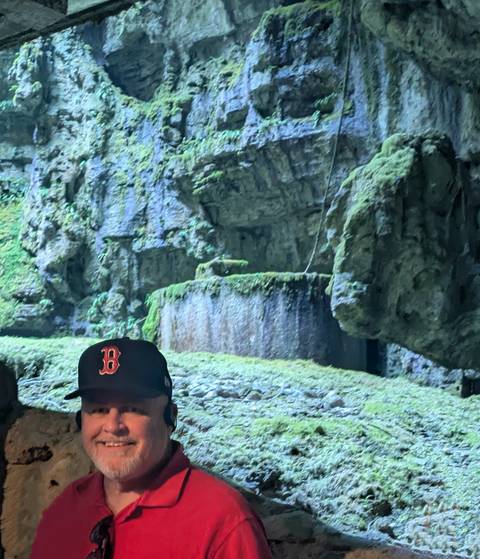       Person partially obscured by rock formations
  