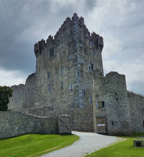       Stone castle under cloudy skies.
  