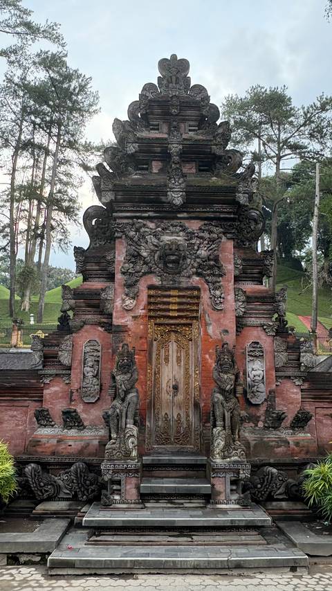       Ornate stone gate with intricate carvings.
  