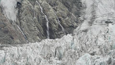 Close-up of glacial ice and rock formations.