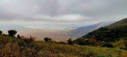 View of a crater lake with lush surroundings.