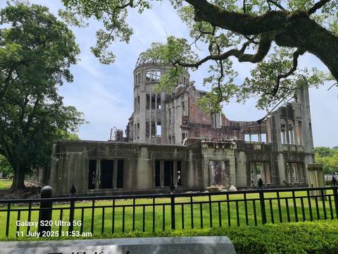       Ruins of a historical building in a park setting.
  