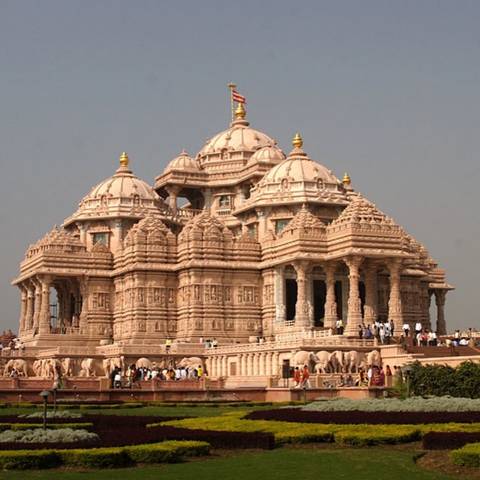 A grand temple with numerous domes and intricate carvings.