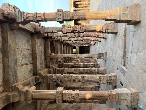 Ancient stone columns with intricate carvings.