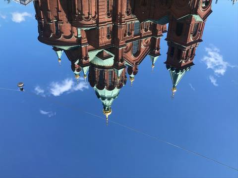       Ornate cathedral with multiple domes and pinnacles.
  