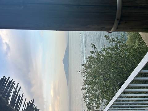 View of the sea and a mountain from a terrace.