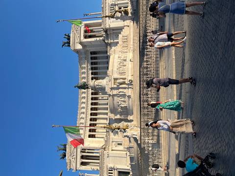       View of the Vittoriano monument under a clear blue sky.
  