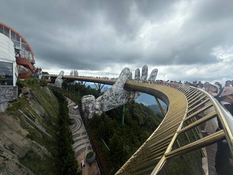 Golden Bridge in Da Nang with giant hands, crowded with tourists.