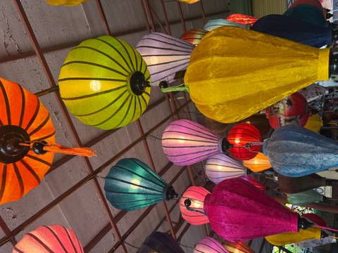 Colorful lanterns hanging in a market.