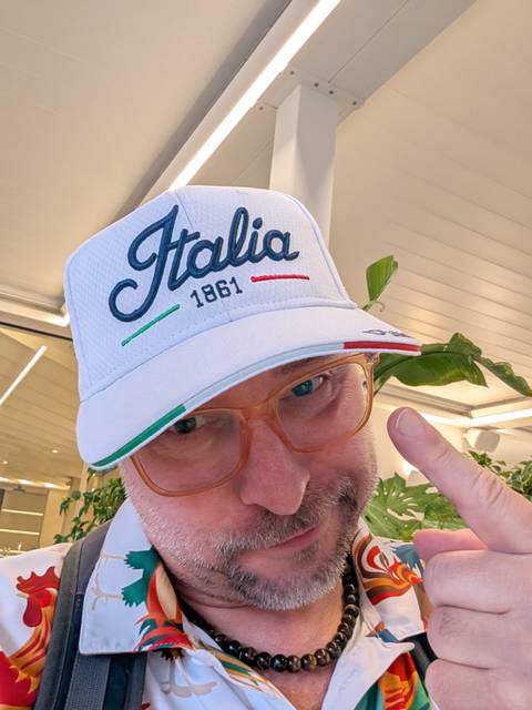 Person wearing an Italia cap indoors