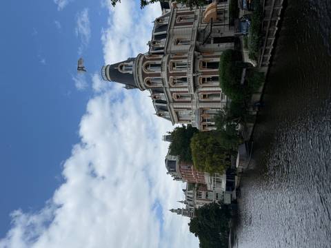Canal with classic buildings and a boat.