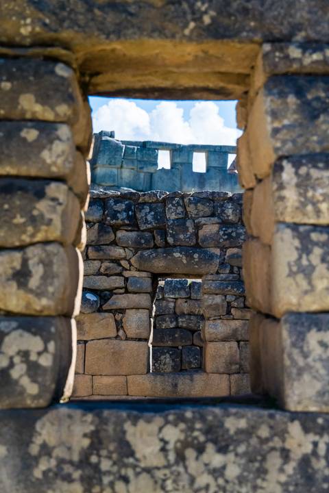 Close-up view through ancient stone architecture.