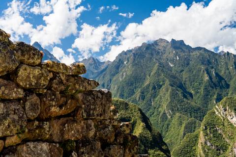 View of ancient stone structure with mountains.