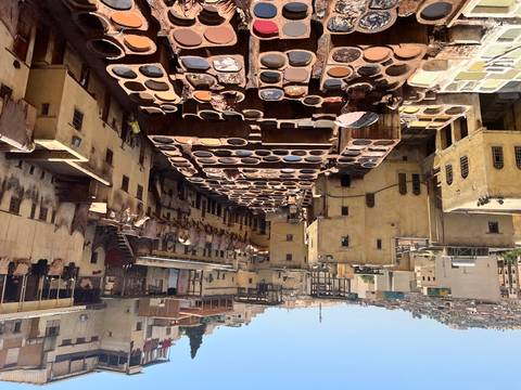 Aerial view of the ancient tannery in Fes with traditional dyeing vats.