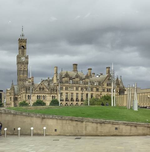 Grand historical building with clock tower.