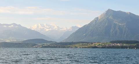       Scenic view of a lake with mountains in the background
  