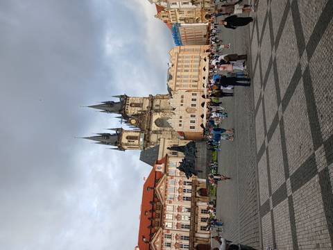 Old Town Square in Prague with the Church of Our Lady before Týn and tourists.