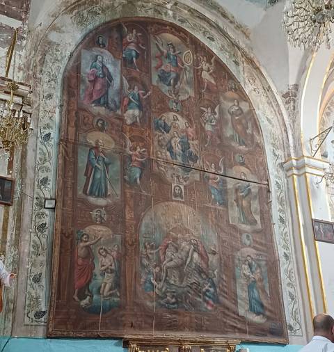      Large religious artwork inside a building, various figures depicted.
  