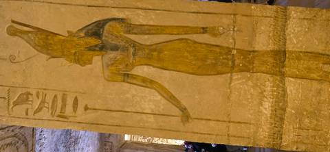 Large wall carving of an Egyptian figure.