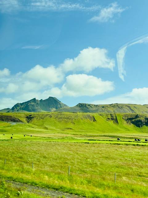 Majestic Icelandic mountains under a bright blue sky.