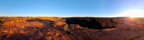       Canyon landscape with red rocks and a bright blue sky.
  