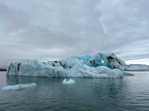Scenic view of icebergs in a calm glacial lagoon.
