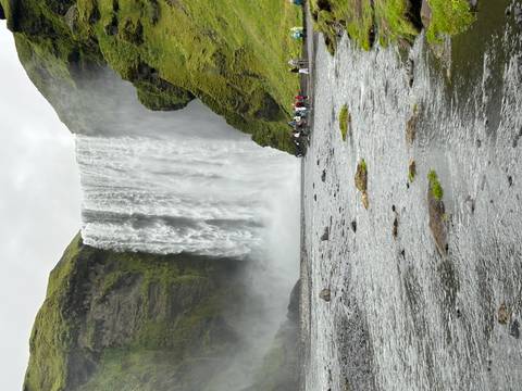       Large waterfall creating mist at the base.
  