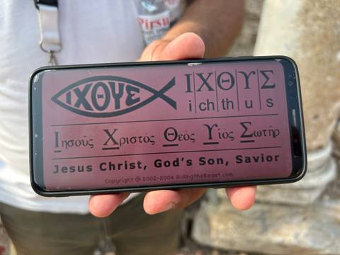       A phone displaying an 'Ichthys' message.
  