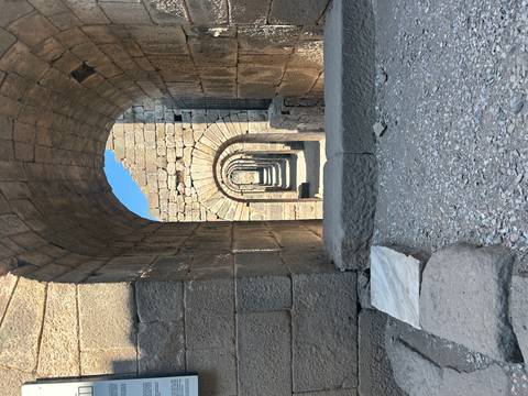       Ancient stone arches with repeating pattern.
  