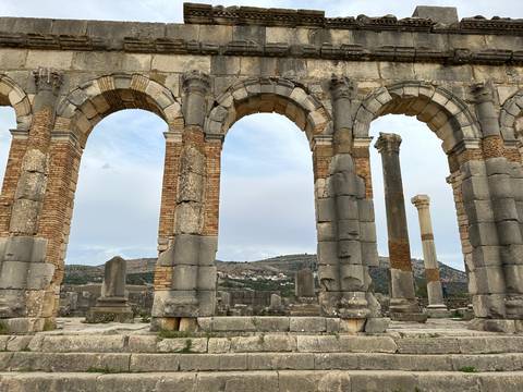 Ancient stone arches in a ruin.
