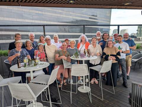 Group enjoying drinks on a rooftop terrace