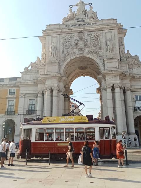       Colorful small coastal town with houses on stilts.
  