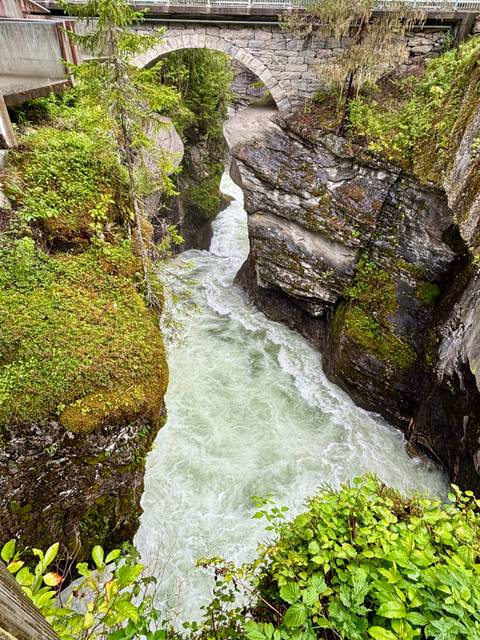 Narrow gorge river flowing between rocks.