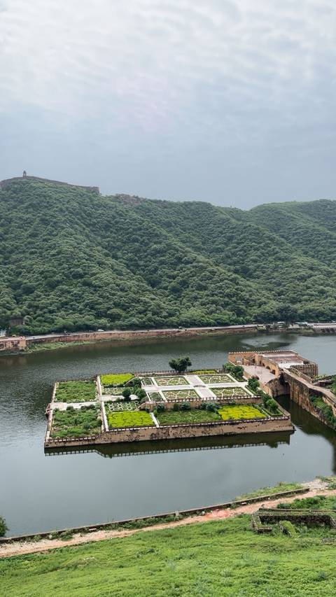 Hills with a view of a rectangular fort base.
