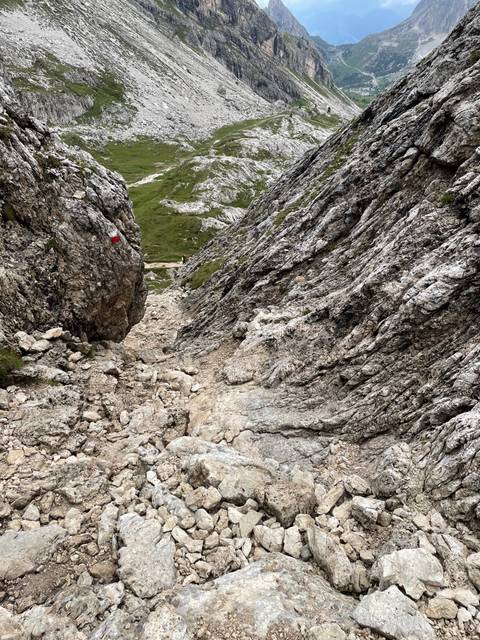 Rocky pass through rugged mountain terrain.